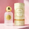 HUA0345 perfume bottle, cylindrical transparent colorless glass body with vertical ribbed texture, 50 ml or 100 ml liquid, spherical glossy gold plastic cap with magnetic closure, gold bottle neck, gold aluminum label attached on bottle surface, elegant luxury design, ideal for gifting and daily use.